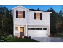 New construction home with black shutters, brick accents, and a two-car garage at 648 Red River Dr, Garner, NC 27529