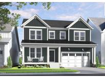 Charming two-story home with a covered front porch, white trim, and a well-manicured lawn at 1601 Merry Mdw Way, Wendell, NC 27591