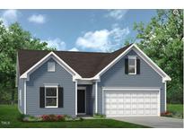 Charming single-Gathering home featuring a 2-car garage, and complemented by lush landscaping at 66 E American Marigold Dr, Benson, NC 27504