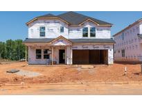 Exterior shot of an incomplete two-story home with Tyvek wrap, ready for customization at 760 Deschutes Dr, Garner, NC 27529