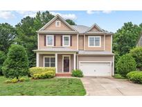 Charming two-story home with a manicured lawn, attached garage and beautiful landscaping at 108 Teagan Ct, Chapel Hill, NC 27516