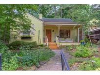 Charming single-story home with a landscaped front yard and a welcoming front porch, perfect for relaxing at 1405 Pennsylvania Ave, Durham, NC 27705
