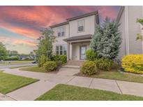 Charming two-story home featuring a well-manicured lawn and mature landscaping at 1624 Tunnel St, Wendell, NC 27591