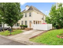 Charming two-story home with a well-manicured lawn, inviting curb appeal, and private gated area at 2445 Sapphire Valley Dr, Raleigh, NC 27604