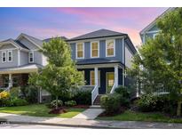 Charming two-story home with a landscaped front yard, classic architecture, and inviting curb appeal at 442 Granite Mill Blvd, Chapel Hill, NC 27516