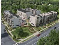 Stunning aerial view of new townhome community surrounded by lush greenery at 509 Kildaire Farm Rd # 307, Cary, NC 27511