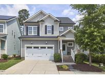 Charming two-story home with a manicured lawn and an attached two-car garage in a well-kept neighborhood at 554 Beacon Ridge Blvd, Chapel Hill, NC 27516