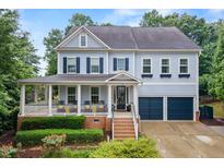 Charming two-story home with a welcoming front porch and well-maintained landscaping at 101 Ironcreek Pl, Apex, NC 27539