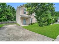 Charming two-story home with a well-maintained lawn and long private driveway at 110 Knightwood Dr, Durham, NC 27703