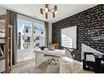 Bright office featuring modern light fixture, large window and designer wallpaper at 1230 Coach Station Alley # 201, Raleigh, NC 27601