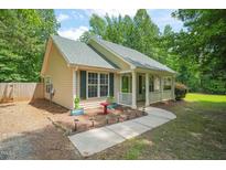 Charming single-story home featuring a cozy front porch and well-maintained landscaping at 2116 Sterling Creek Ln, Franklinton, NC 27525