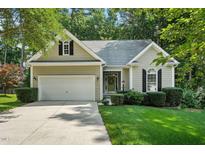 Charming single-story home with well-manicured lawn, attached garage, and welcoming front entrance at 2425 Lemuel Dr, Raleigh, NC 27615