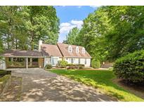 Charming home with a well-manicured lawn and beautiful trees at 3705 Old Post Rd, Raleigh, NC 27612