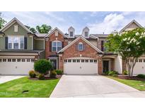 Charming townhome with attached garage and manicured lawn at 238 Lynchwick Ln, Durham, NC 27703