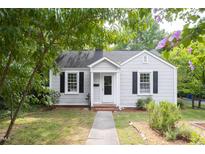 Charming one story home with black shutters and a sidewalk leading up to the front door at 2423 Farthing St, Durham, NC 27704