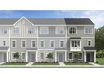 Charming townhomes showcasing a variety of light gray exterior colors, materials, and stylish architectural details at 474 Carolina Springs Dr, Apex, NC 27539