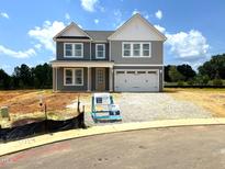 Charming two-story home with a covered front porch and two-car garage at 35 Windflower Ct # Homesite 9, Clayton, NC 27520