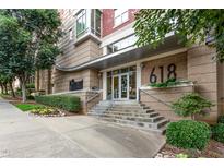 Exterior view of building entrance featuring a modern design and well-manicured landscaping at 618 N Boylan Ave # 520, Raleigh, NC 27603