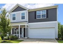 Charming two-story home with gray and light gray siding, an attached two-car garage, and a welcoming front porch at 114 Forest Meadow Ct, Garner, NC 27529