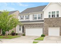 Charming two-story home with stone accents and a two-car garage at 1416 Southpoint Trl, Durham, NC 27713