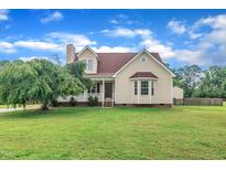 Charming home with a well-manicured lawn and a inviting front porch, perfect for relaxing in the serene neighborhood at 35 Stratton Ct, Youngsville, NC 27596