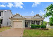 Charming single-Gathering home with a well-manicured lawn and attached one car garage at 51 Balboa Pkwy, Clayton, NC 27520