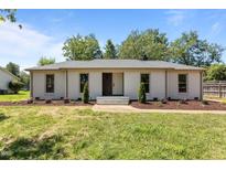 Charming single-story home with fresh paint, manicured landscaping, and inviting front entrance at 620 Red Carriage Ave, Durham, NC 27704