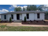 Charming single story home featuring a tidy landscaped yard and traditional curb appeal at 620 Red Carriage Ave, Durham, NC 27704