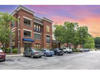 Beautiful brick apartment building with balconies and well-maintained parking lot at 7250 Nc 751 Highway, #1205, Durham, NC 27707