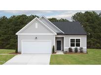 Charming single Gathering home with a two car garage and well maintained lawn at 11751 Salers Loop Loop, Middlesex, NC 27557