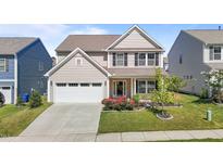 Charming two-story home featuring a well-manicured lawn and a welcoming front porch at 1414 Arena Ln, Fuquay Varina, NC 27526
