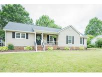 Charming one-story home with a welcoming front porch and well-maintained landscaping at 2120 Northcrest Dr, Elon, NC 27244