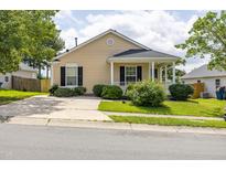Charming single-story home featuring a welcoming front porch and well-manicured landscaping at 418 Lodestone Dr, Durham, NC 27703