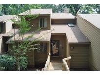 Inviting two-story home with wooden porch and walkway leading to the front door at 80 Stoneridge Rd, Durham, NC 27705