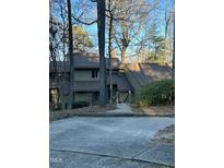 Charming multi-story home nestled amongst trees, providing a serene and private setting at 80 Stoneridge Rd, Durham, NC 27705