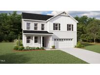 Charming two-story home with a manicured lawn, attached two-car garage, and classic white siding at 180 Sprenger St, Garner, NC 27529