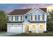 Charming two-story home featuring a welcoming front porch, complemented by blue shutters and a well-manicured lawn at 3205 Pelican Ln, Durham, NC 27703