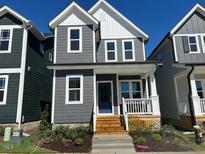 Charming two-story home with gray siding, white trim, and a welcoming front porch at 502 Yeowell Dr, Chapel Hill, NC 27514