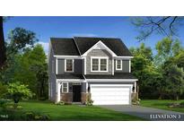Charming two-story home with stone accents, attached two-car garage, and well-maintained landscaping at 503 Hipwood Dr, Zebulon, NC 27597