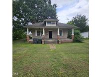 Charming single-Gathering home with a classic front porch and mature trees at 505 S 15Th St, Erwin, NC 28339