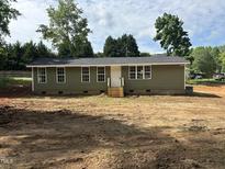 Charming single-story home with a freshly painted exterior, new roof, and unfinished front yard at 8505 Ray Rd, Raleigh, NC 27613