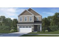Charming two-story home featuring a two-car garage, stone accents, and a classic design at 128 Corapeake Way, Apex, NC 27539