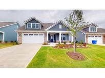 Charming home featuring a two-car garage, manicured lawn and tasteful landscaping at 1720 Pinecliff Ct, Fuquay Varina, NC 27526