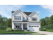 Charming two-story home with stone accents, a covered porch, and a two-car garage at 772 Emerald Bay Cir, Raleigh, NC 27610
