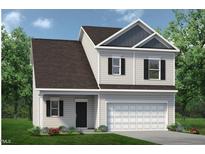Charming two-story home with a large garage, well-manicured lawn, and classic black shutters at 62 Gray Pine Way, Sanford, NC 27332