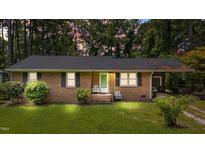 Charming single-story brick home featuring a well-maintained lawn and a welcoming front entrance at 625 Powell Dr, Rocky Mount, NC 27803