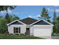 Charming single-story home featuring a two-car garage, well-maintained lawn, and inviting curb appeal at 185 Carriedelle Ln, Wilson's Mills, NC 27577