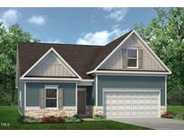 Charming home with blue siding, brick accents, and a two-car garage nestled among lush greenery at 360 Ambassador Dr, Clayton, NC 27520
