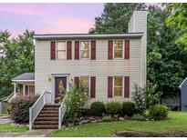 Charming two-story home with red shutters and brick steps leading to a welcoming front entrance at 3605 Iron Sight Ct, Raleigh, NC 27616