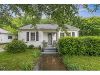 Charming single-story home with a cozy front porch, well-maintained lawn, and mature landscaping at 520 Park Ave, Rocky Mount, NC 27801